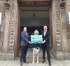 Preston City Council's Chief Executive, Councillor and Leader hold the Councils for Fair Tax banner