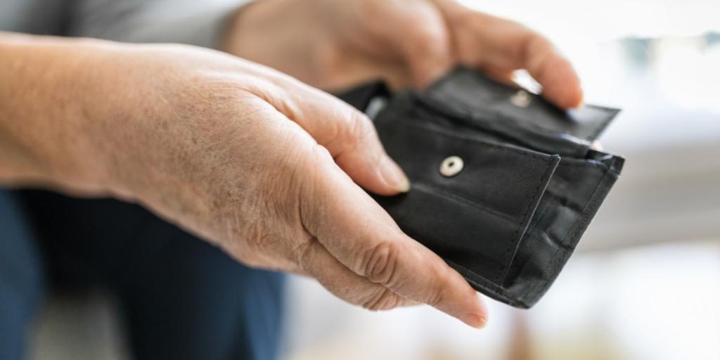 Cost of living Hands holding an empty wallet