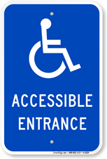 A blue sign with the wheelchair icon saying Accessible Entrance.