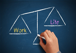 A chalk drawing of a scale with the words work and life on them.